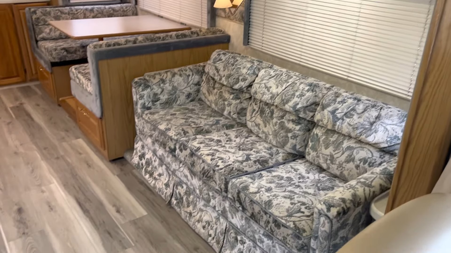 2000 Fleetwood Bounder 39Z — living room slide with sofa sleeper and booth dinette