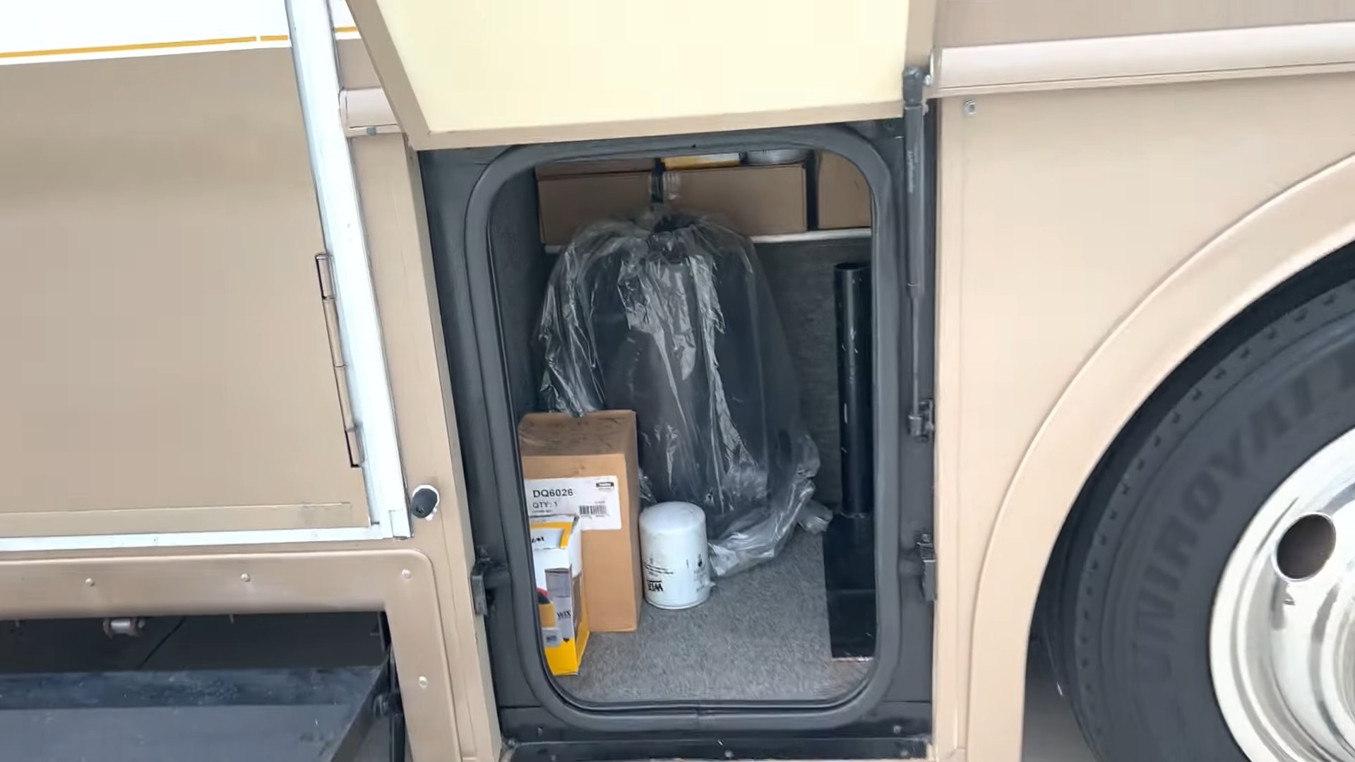 2000 Fleetwood Bounder 39Z — storage compartment behind the entry door