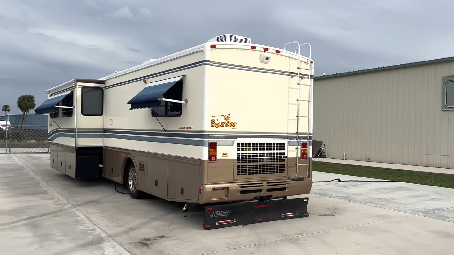 2000 Fleetwood Bounder 39Z — rear passenger side with awning extended