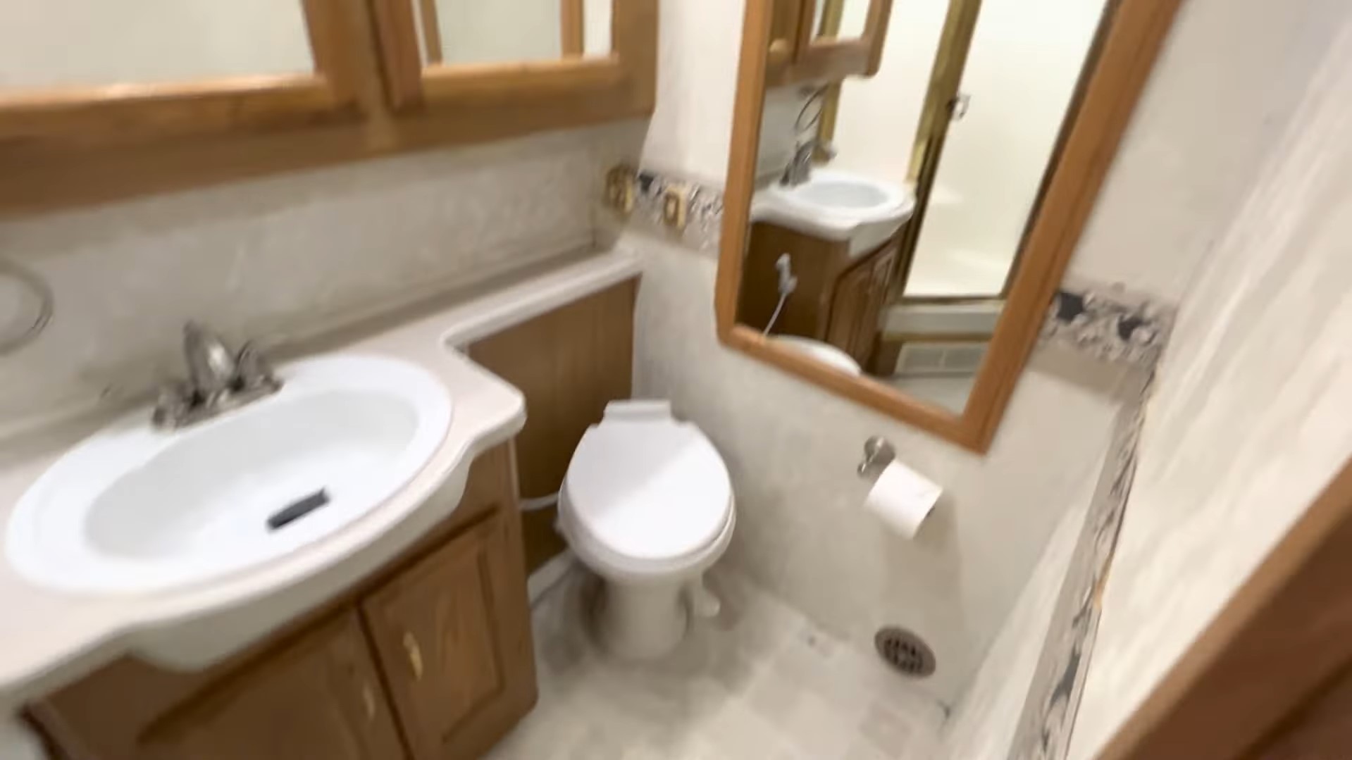 2000 Fleetwood Bounder 39Z — bathroom vanity, mirror and toilet